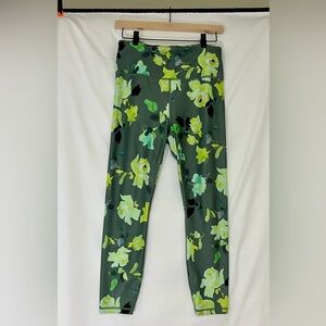 Athleta Elation 7/8 tights, women’s size medium, green floral pattern.